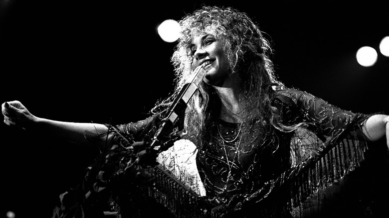 Black and white image of Stevie Nicks on stage with Fleetwood Mac in Atlanta, Georgia in 1977