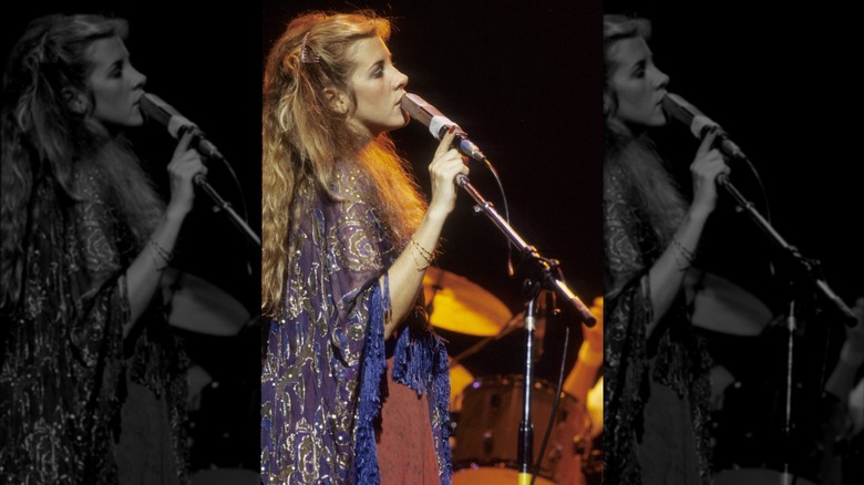 Stevie Nicks performing in 1978 wearing a fringed purple cape