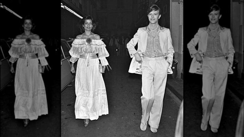 Bianca Jagger and David Bowie walking on the streets of Paris