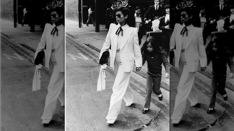 Bianca Jagger and Jade Jagger walking across the street in London in the 1970s