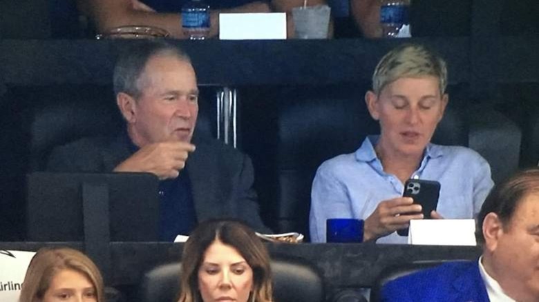 George W. Bish and Ellen DeGeneres sitting together at a Dallas Cowboys game.