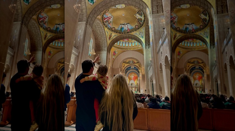 Erika and Charlie Kirk standing in church