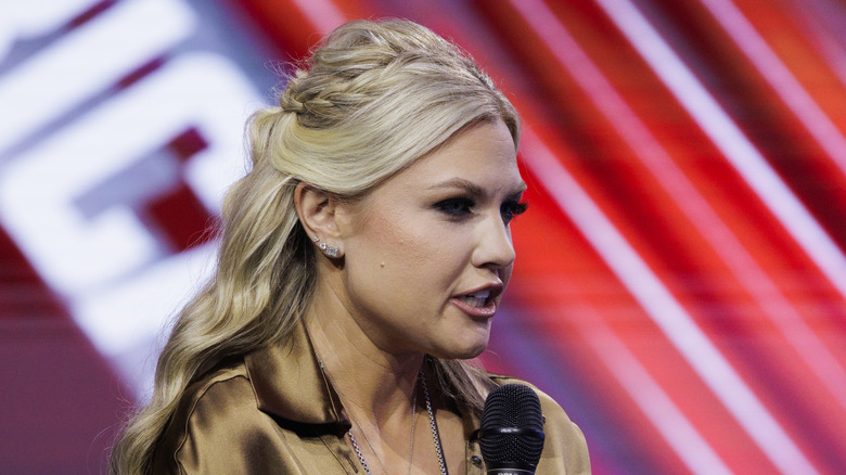 Erika Kirk speaking into microphone