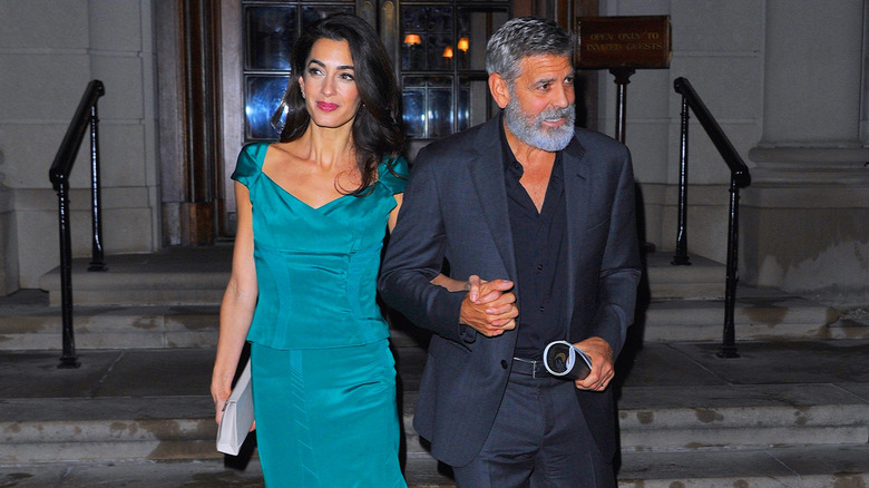 Amal Clooney and George Clooney walking in NYC