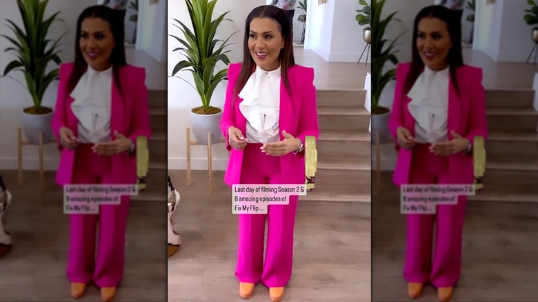 Page Turner in pink suit in a house