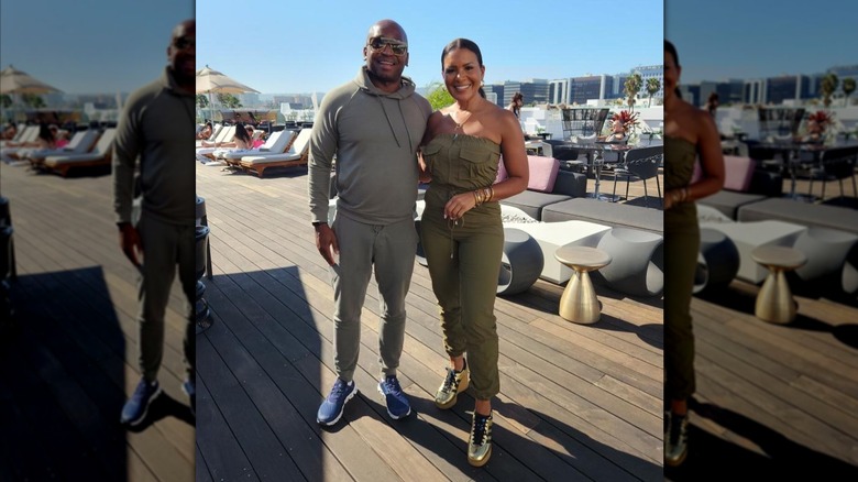Brandon Williams and Page Turner posing outside on deck