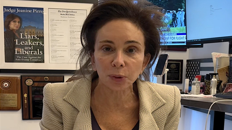 Judge Jeanine Pirro in her office, hair messily thrown up, wearing no makeup