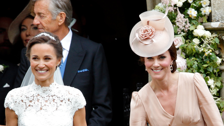 Pippa and Kate Middleton in front of a church