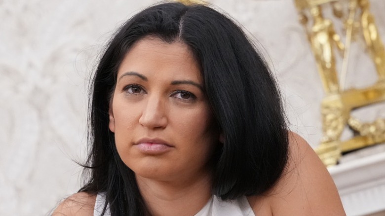 Katie Miller listens in the Oval Office of the White House in Washington, DC (2025)