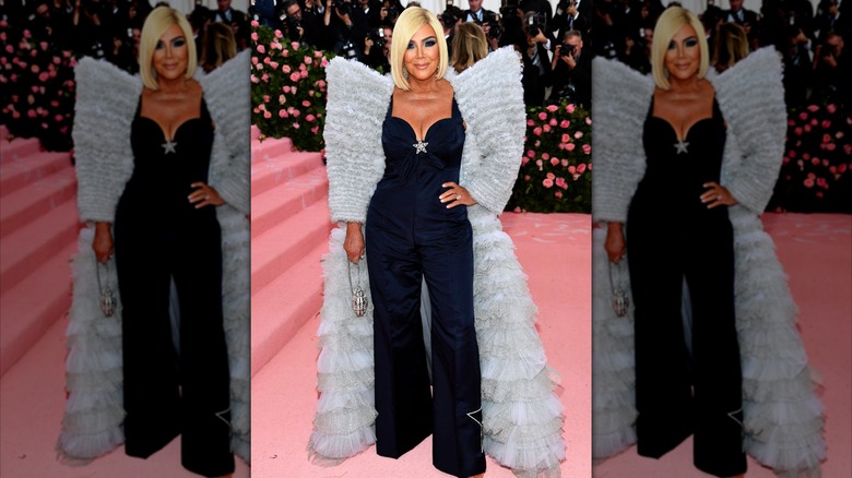 Kris Jenner poses with her hand on her hip