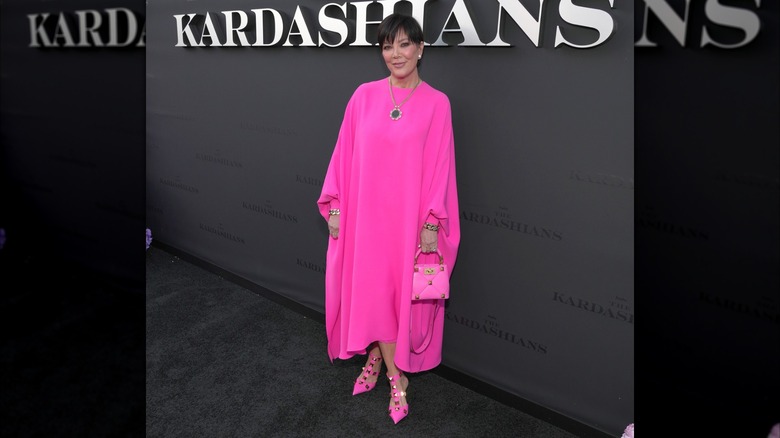 Kris Jenner in a pink dress with matching pink heels