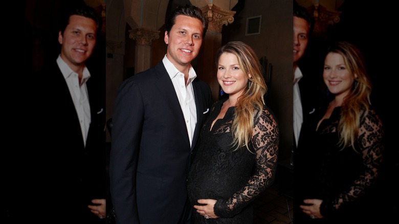 Hayes MacArthur and Ali Larter in black evening wear