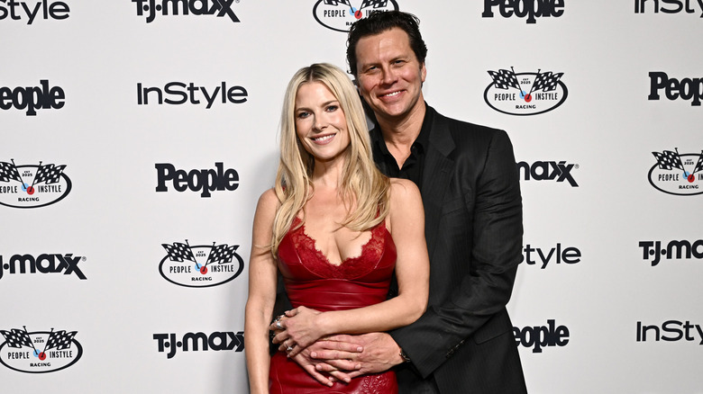 Ali Larter red dress Hayes MacArthur black suit