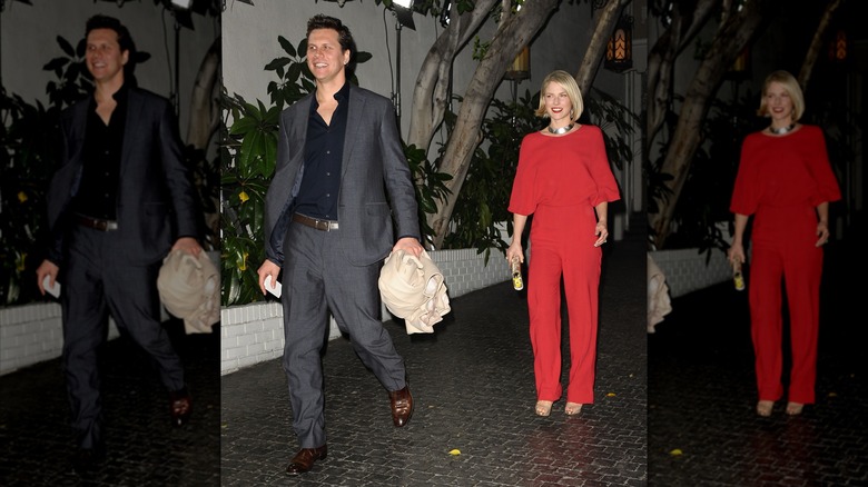 Hayes MacArthur in a gray suit and Ali Larter in a red outfit