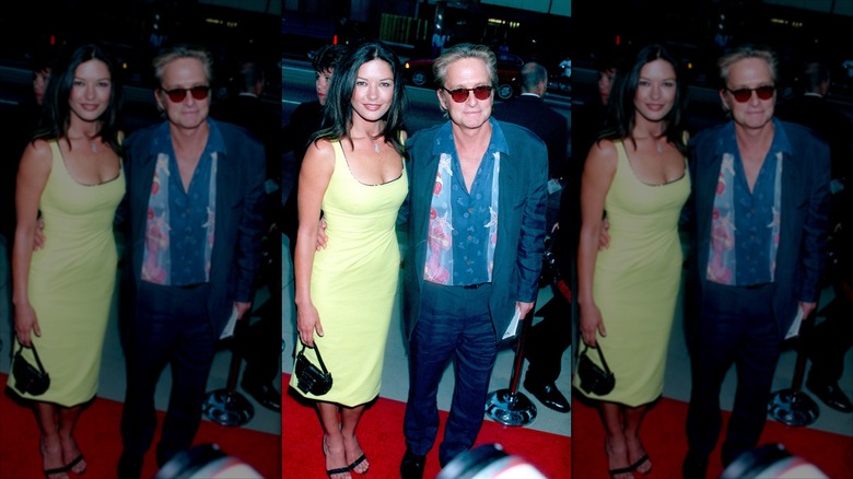 Catherine Zeta Jones in a yellow dress posing with Michael Douglas.