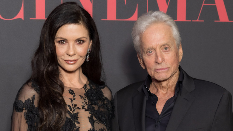 Catherine Zeta-Jones in a black lace dress with husband, Michael Douglas.