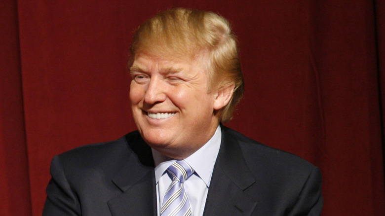 Donald Trump Jr. and Donald Trump smile during the lunch of Trump Mortgage, LLC at Trump Tower in Manhattan, New York, on April 5, 2006 (2006)