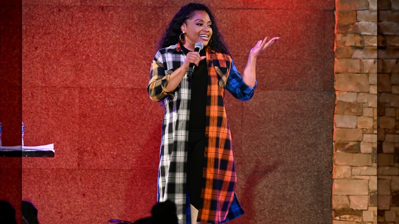 Sherri Shepherd talking into a microphone on stage