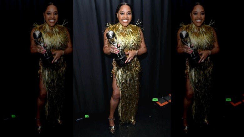 Sherri Shepherd smiling and holding award