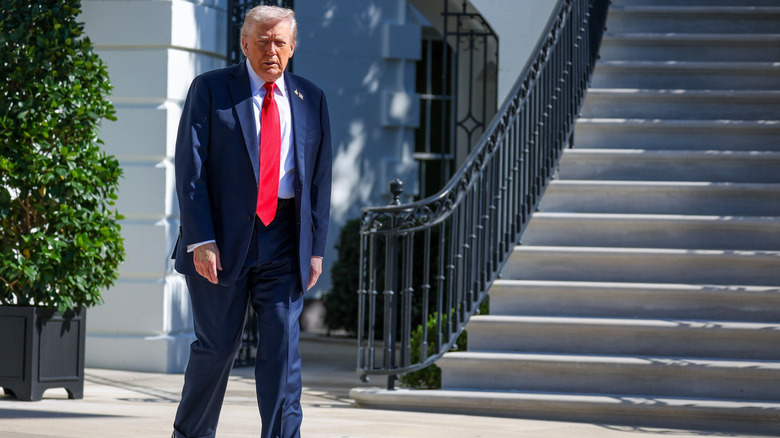 Donald Trump walking outside.