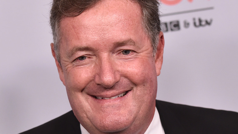 Piers Morgan smiling at event