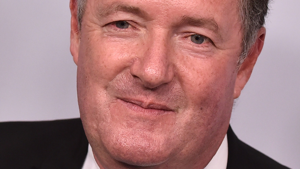 Piers Morgan slightly smiling