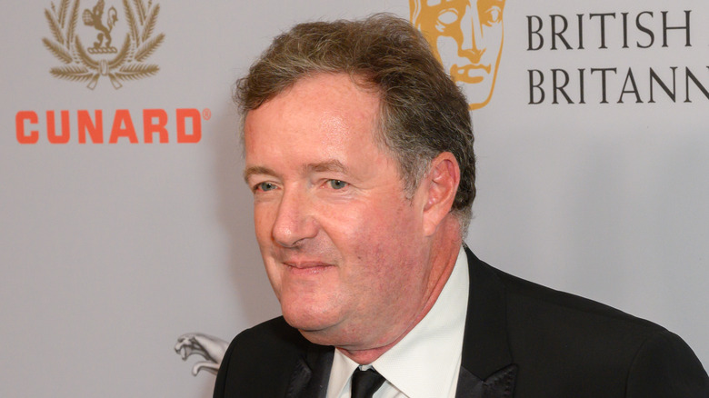 Piers Morgan posing on awards show red carpet