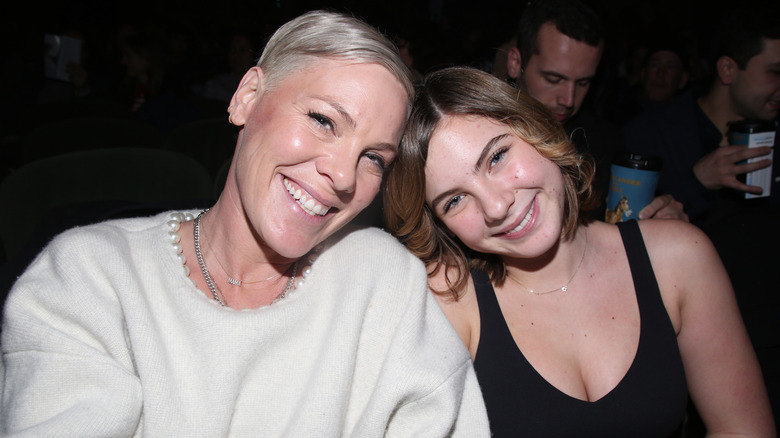 Pink and daughter Willow touching heads and smiling