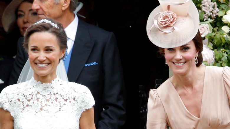 Pippa Middleton and Kate Middleton smiling