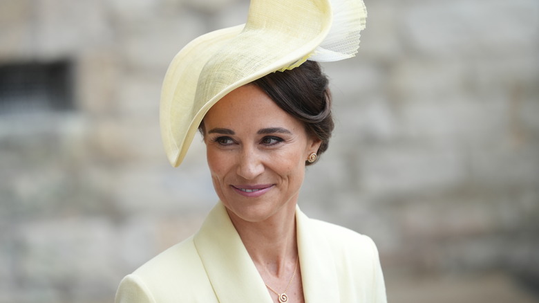 Pippa Middleton smiling in yellow hat
