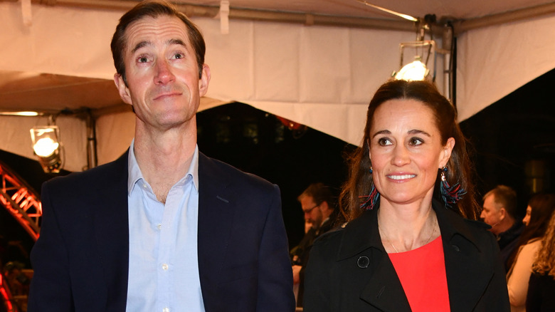 A smiling James Matthews and Pippa Middleton standing next to each other