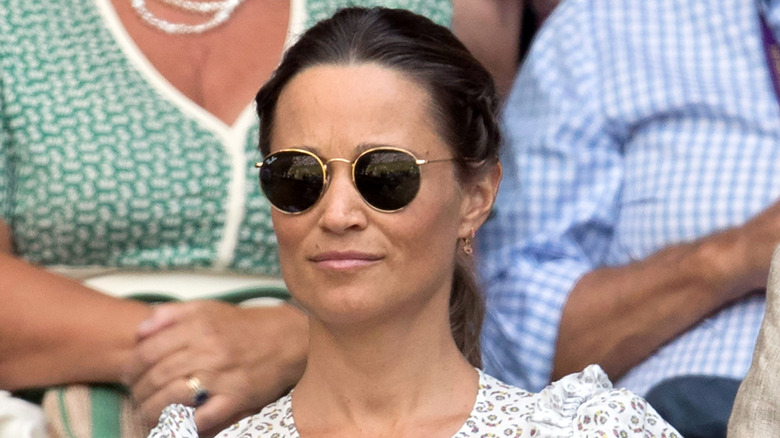 A serious-looking Pippa wearing sunglasses