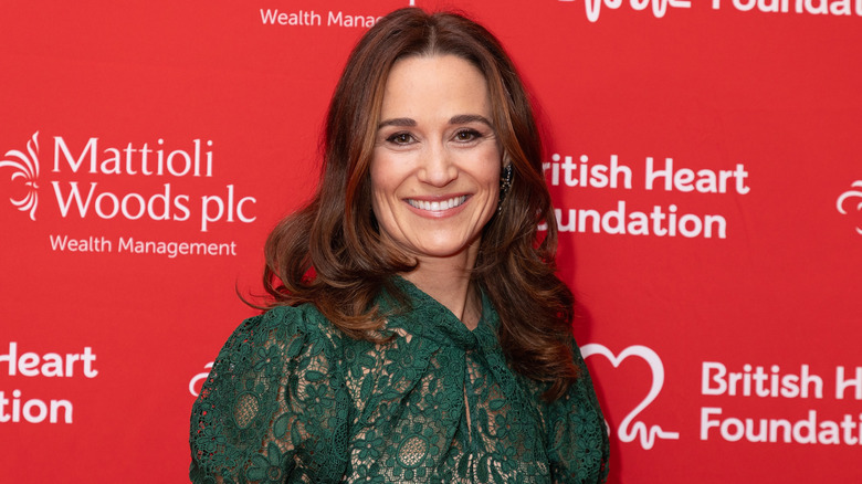 Close-up of Pippa Middleton in front of a red backdrop.