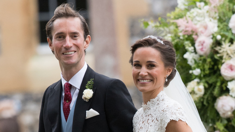 James Matthews and Pippa Middleton smiling in wedding attire