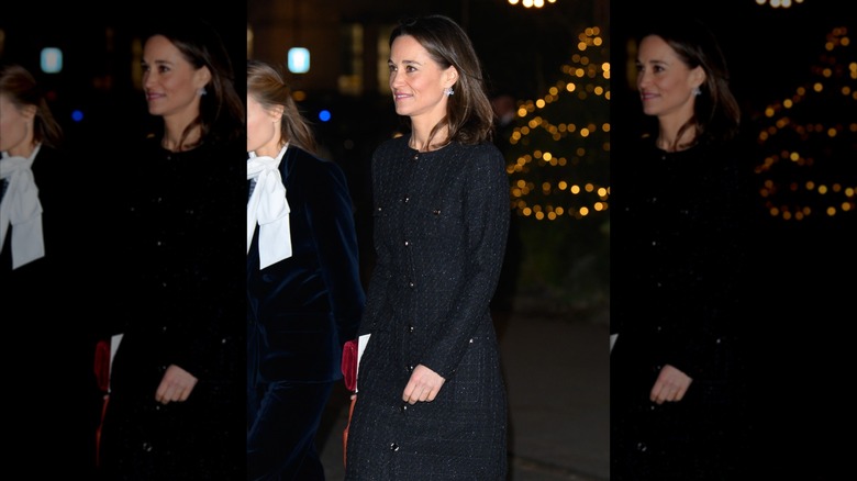 Pippa Middleton spotted attending a Christmas event in a black coat without her wedding ring