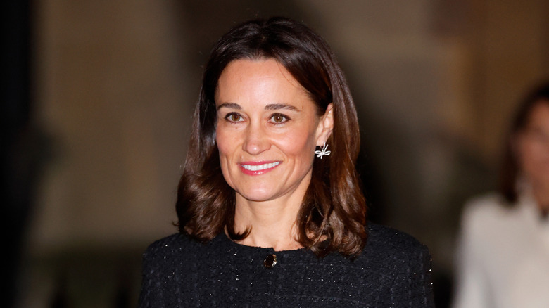 Pippa Middleton smiling at Kate's carol concert in 2024