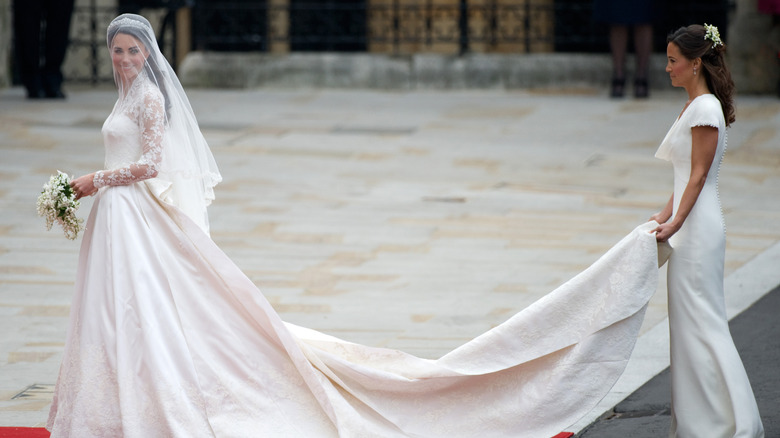 Pippa Middleton carrying Kate Middleton's wedding gown train