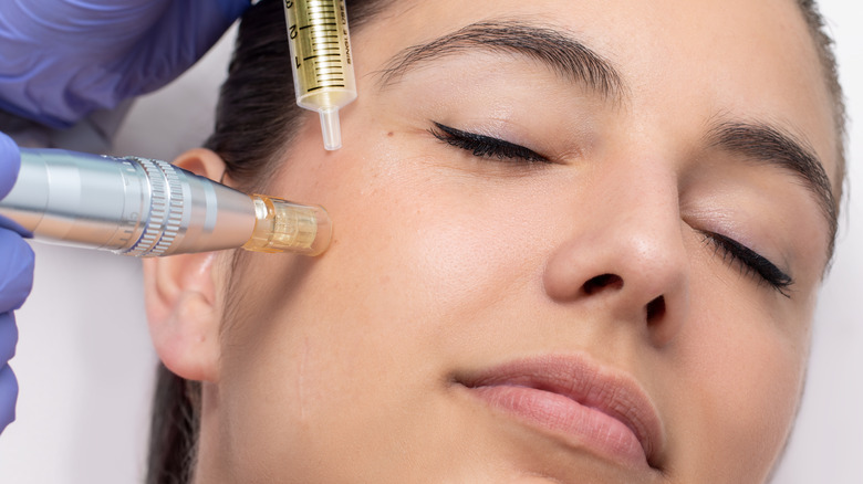 A woman receiving a plasma pen treatment 