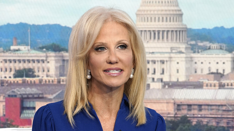 Kellyanne Conway speaking on air in a blue blouse