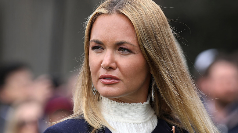 Vanessa Trump frowning in a white turtleneck with her hair loose