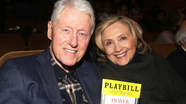 Bill and Hillary Clinton out at a play