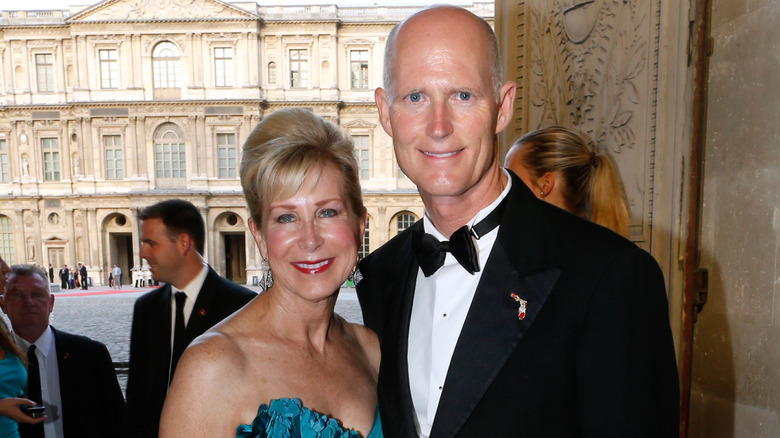 Ann and Rick Scott smiling in formal attire