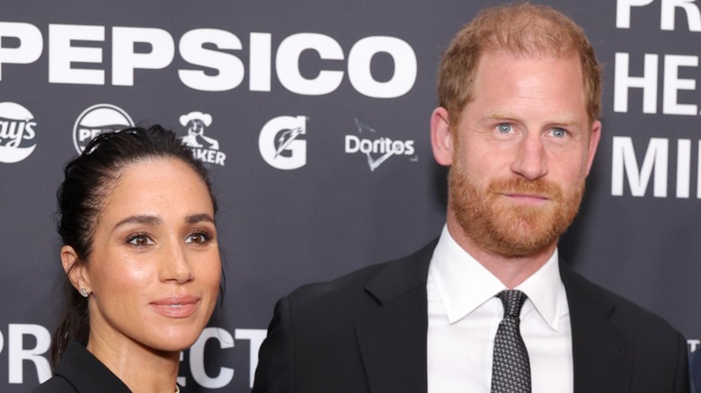Prince Harry and Meghan Markle posing at an event together