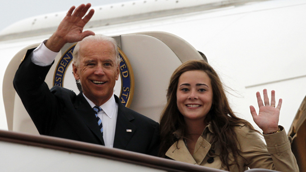 Joe Biden and granddaughter waving