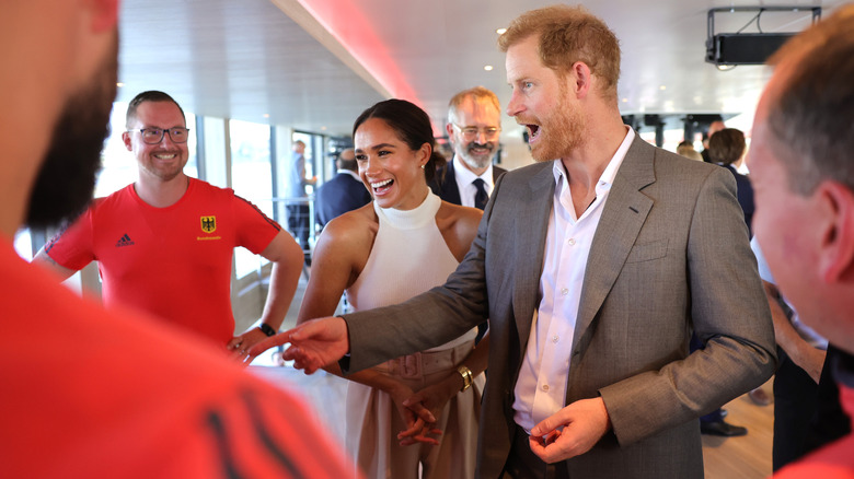 Meghan Markle and Prince Harry greeting fans 