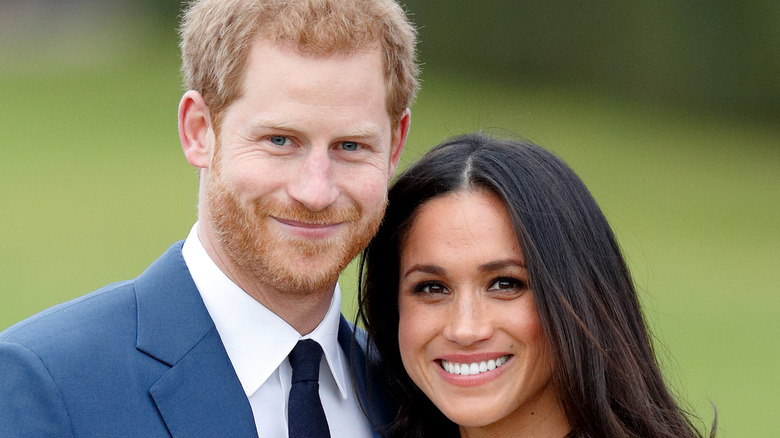 Prince Harry and Meghan Markle smiling 