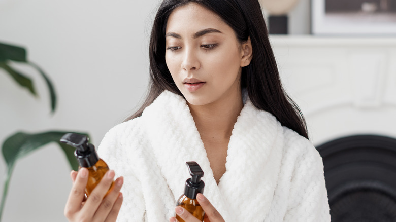 Woman holding skincare products