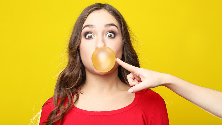 woman blowing bubble