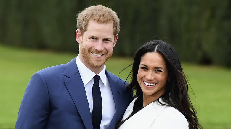 Prince Harry and Meghan Markle smiling