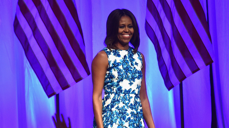 Michelle Obama showing her arms in a sleeveless dress